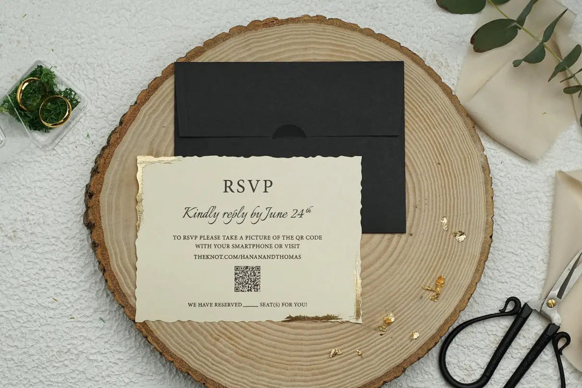 Ivory deckle edge RSVP wedding card with gold edging and black envelope